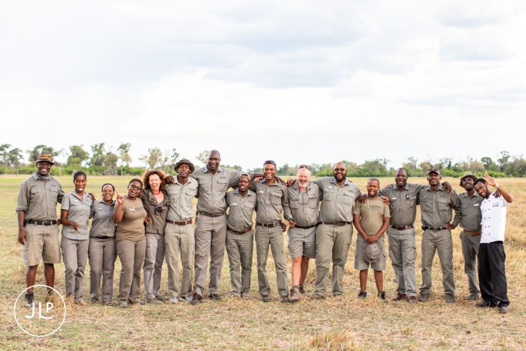 A group photo of the lodge staff and guides at a beautiful Khwai Private Reserve destination wedding.