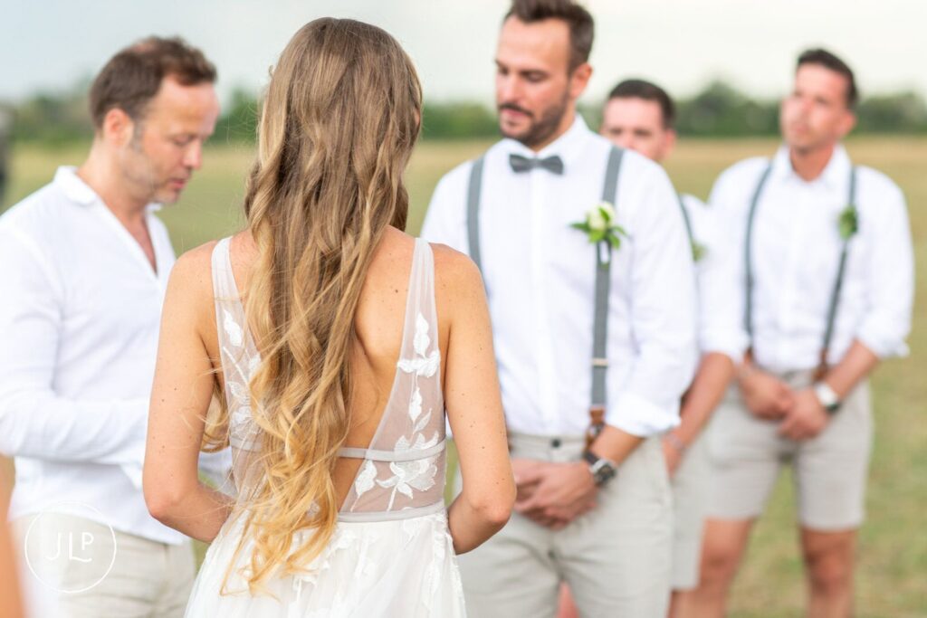 Close-up shot of a couple exchanging vows during their romantic safari wedding photography session.