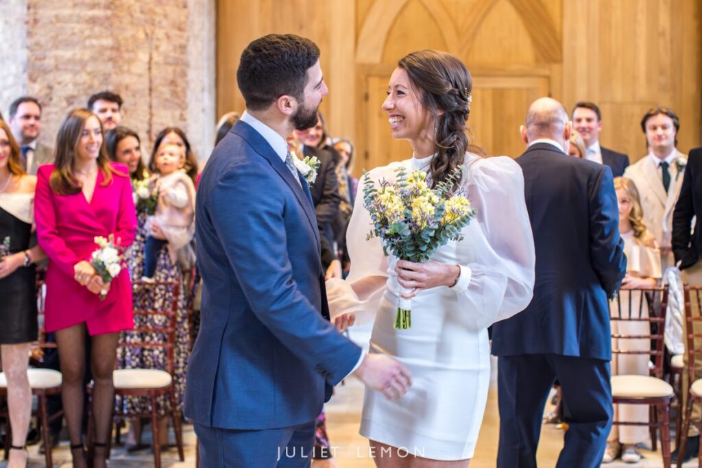 A happy moment during the ceremony at this stunning Abney Park wedding venue photography location.