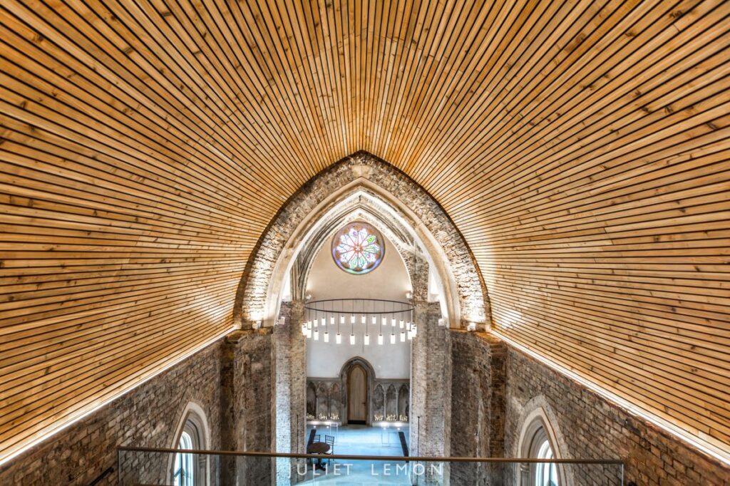 Wide interior view from the balcony of the historic Abney Park Chapel wedding venue in Stoke Newington.