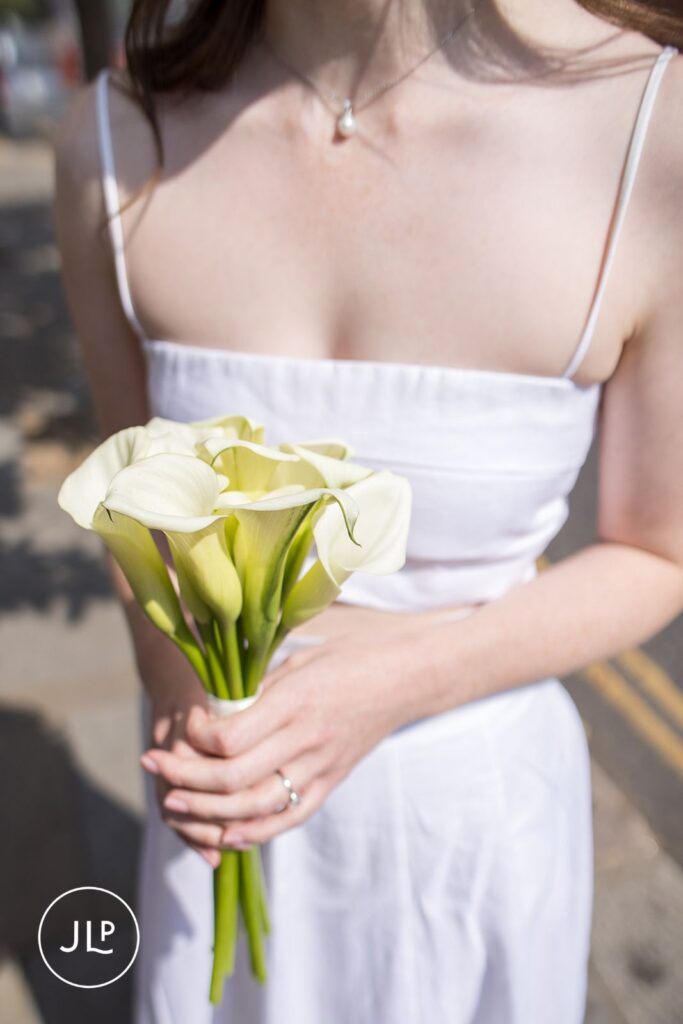 Elegant bridal bouquet of white calla lilies.