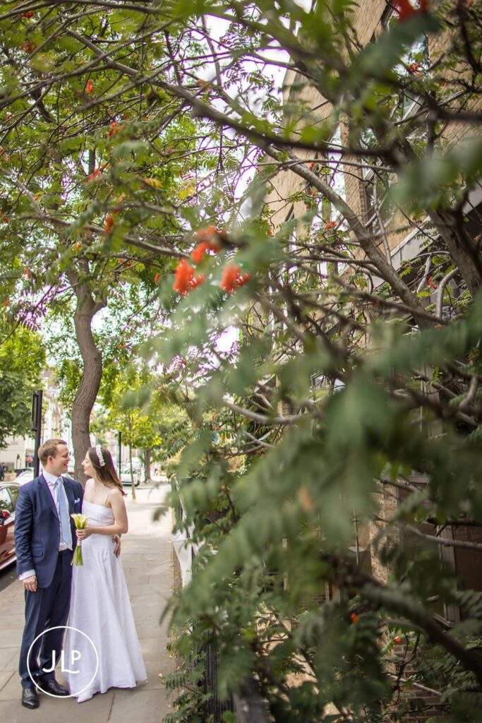 Romantic wedding portrait of Erin and Robert on a leafy Chelsea street.