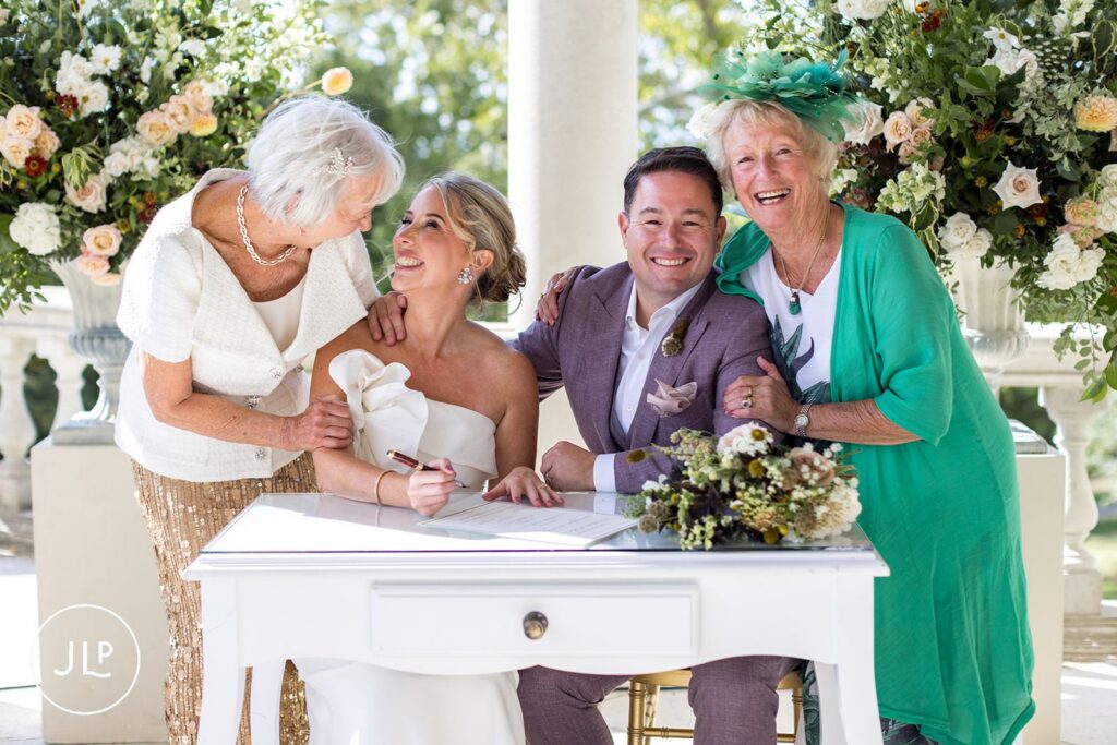 Signing the register during a joyful Cliveden Pavilion wedding