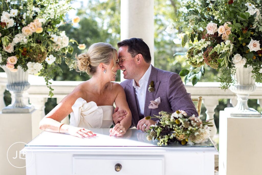 Candid laughter between newlyweds at their Cliveden House wedding