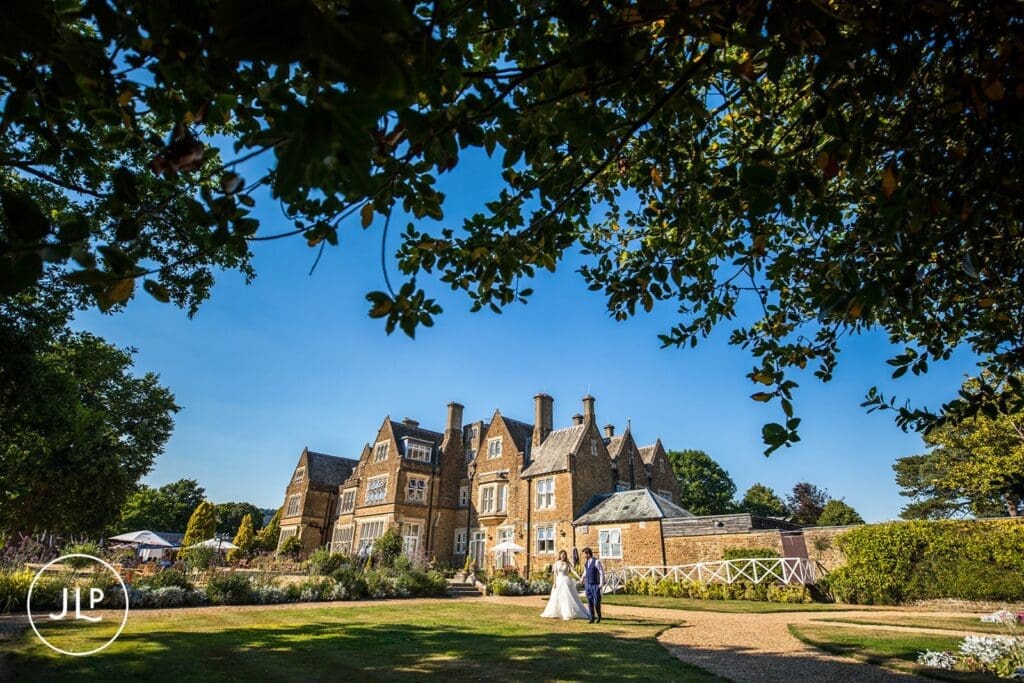 The scenic estate grounds and striking Victorian architecture hosting elegant Hartsfield Manor weddings.