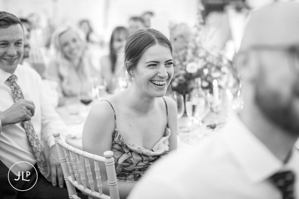 An elegant wedding guest toast during a luxury outdoor wedding Surrey.