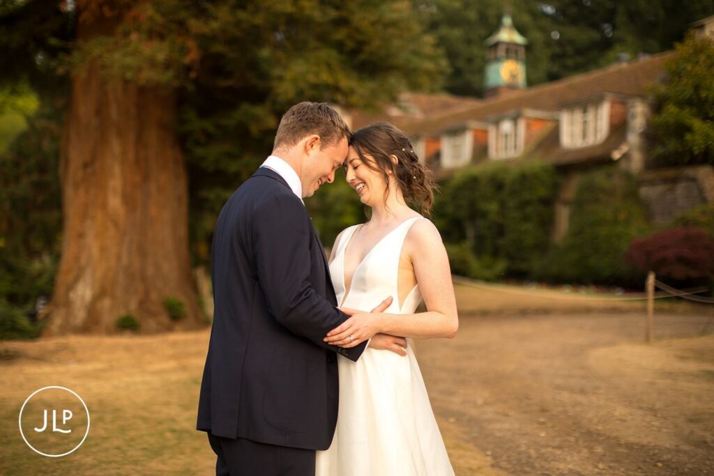 Romantic sunset portrait of the couple at a private estate wedding Surrey.
