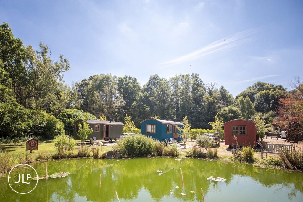 Shepherd's huts used for bridal prep at a luxury Surrey marquee