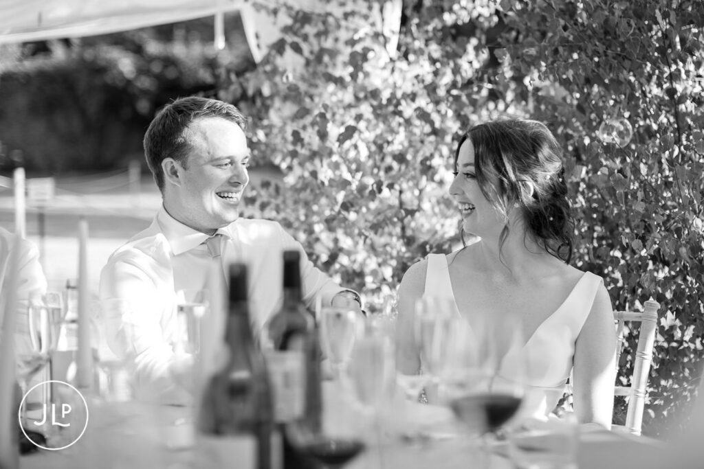 Emotional black and white candid of a couple at a luxury Surrey marquee wedding.