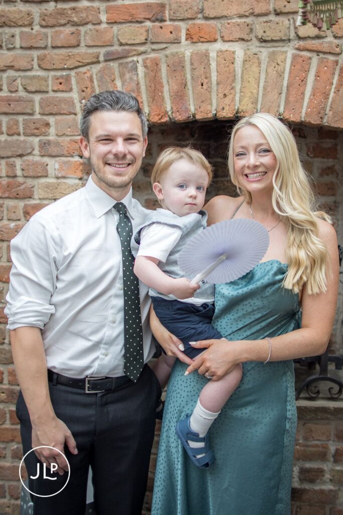 A family portrait of wedding guests captured by a professional Chelsea Old Town Hall wedding photographer.