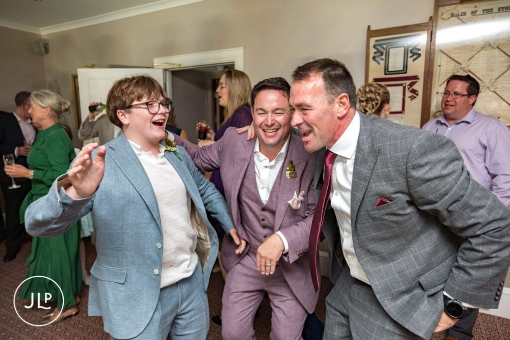 Groom and guests celebrating at this luxury UK wedding venue.