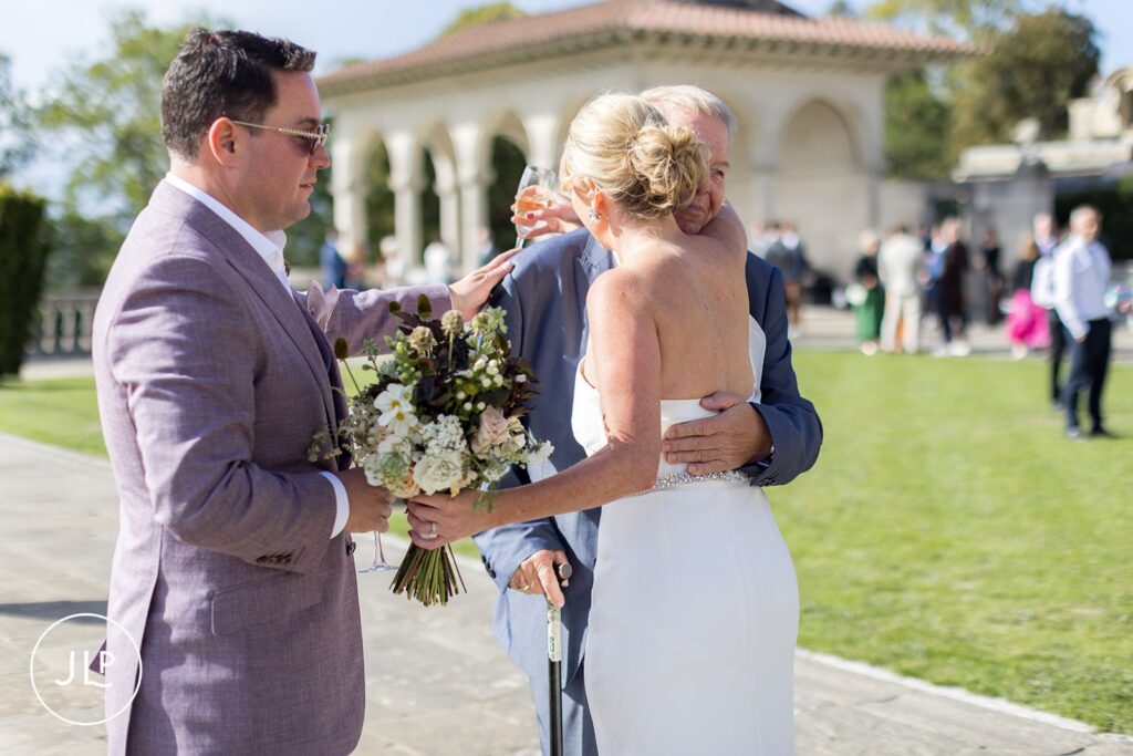 Emotional embrace during a sunny Cliveden Pavilion wedding reception