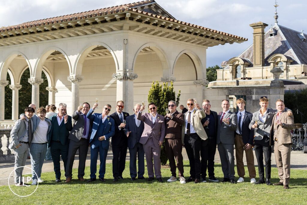 Large group toast at this luxury UK wedding venue