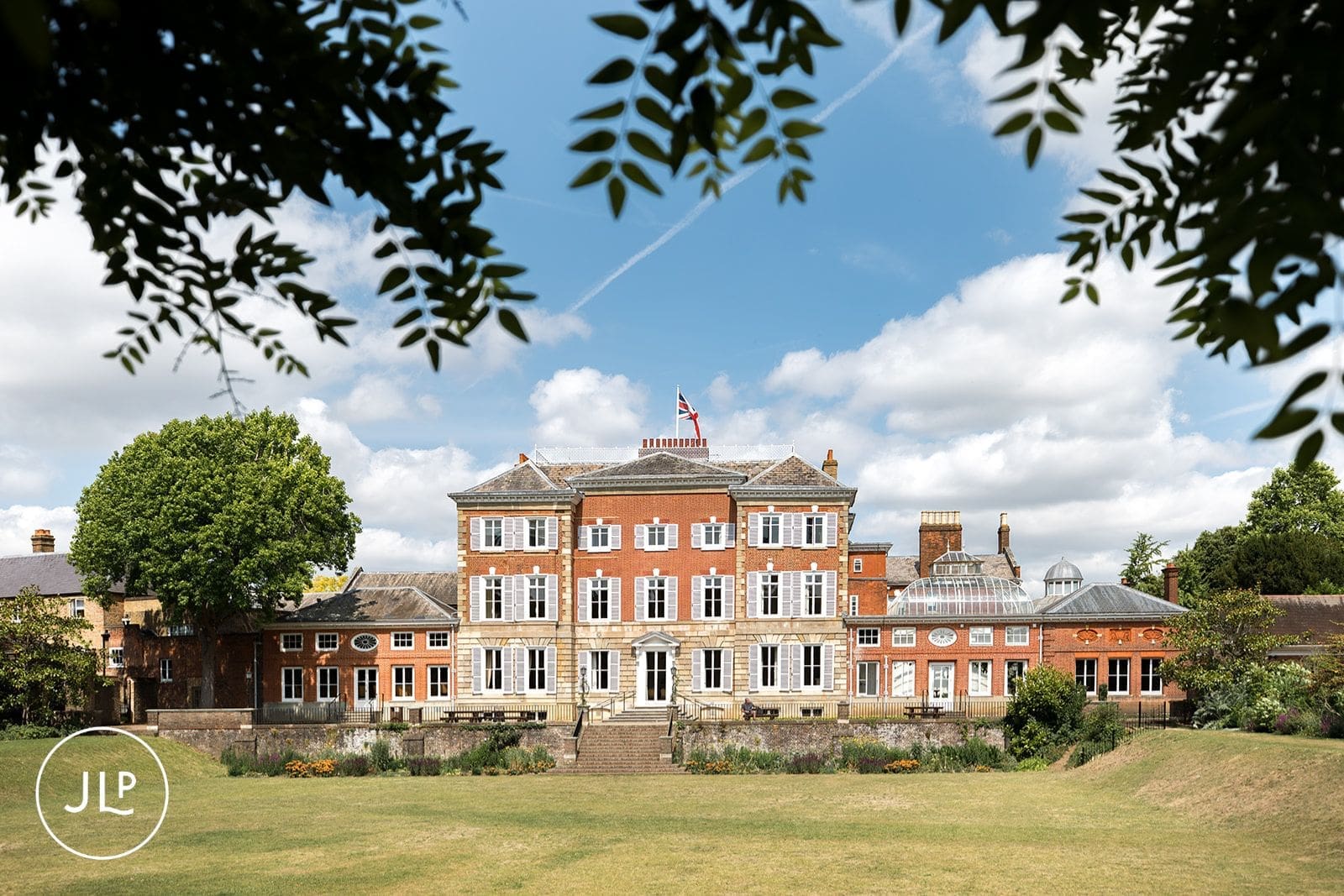 Wide shot of the historic building and gardens captured by a York House wedding photographer.