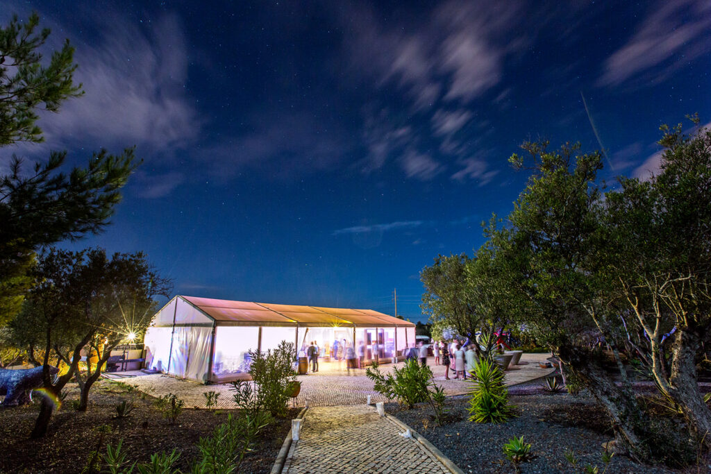 Illuminated wedding marquee under a starry sky, a luxury Quinta dos Vales wedding venue detail in Portugal.