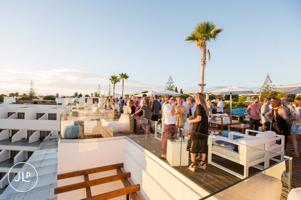 Busy pre-wedding party at Sky Bar Carvoeiro rooftop during a Portugal destination wedding.