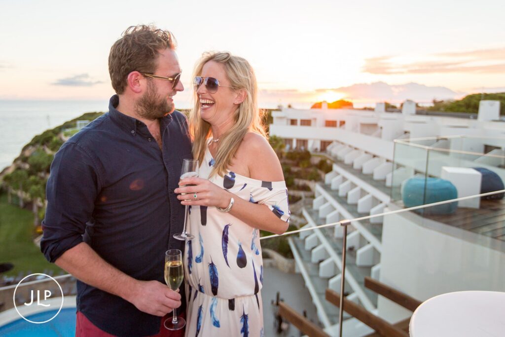 Ali and Matty laughing at their Sky Bar Carvoeiro wedding celebration in the Algarve.