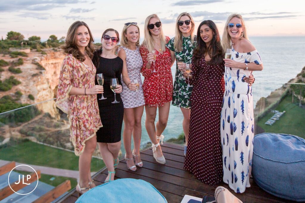 Stylish guests posing for an Algarve welcome party photographer at Tivoli Carvoeiro.