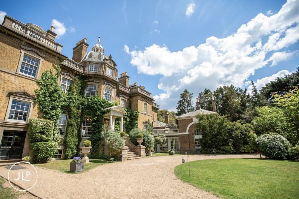 Exterior of Hampton Court House, an elegant Surrey wedding venue shot by a Surrey wedding photographer.