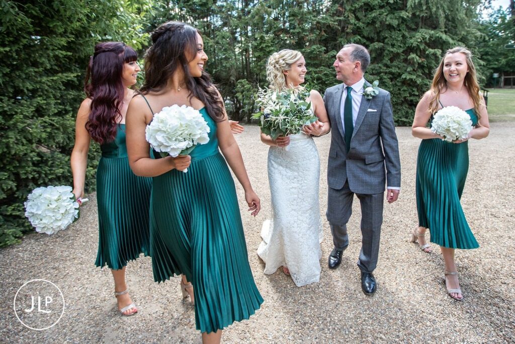 Candid wedding photography of bridesmaids at a Hampton Court House wedding by a Surrey wedding photographer.