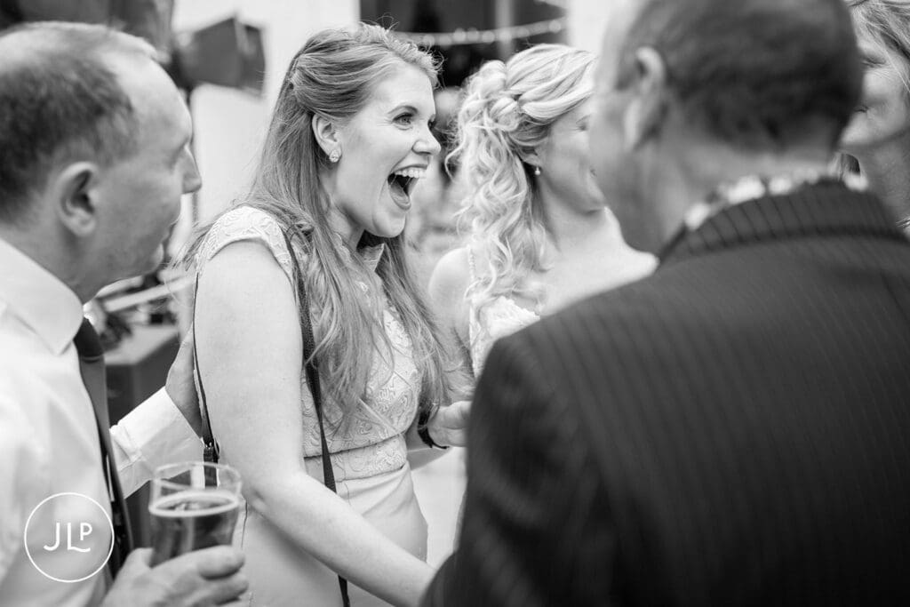 Documentary wedding photography showcasing joyful and relaxed wedding photography at a reception.