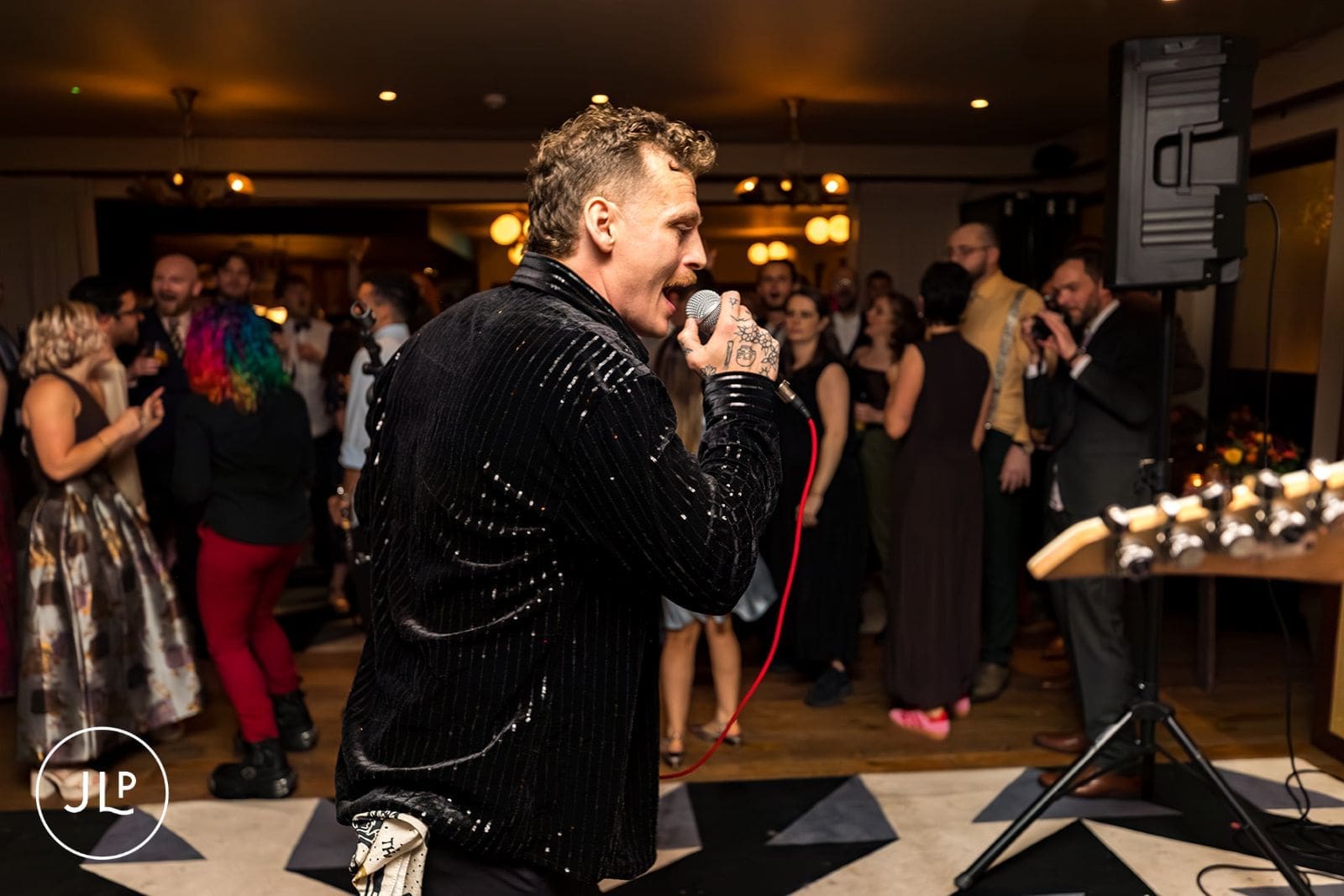 Musical entertainment keeping the crowd dancing at a vibrant central London marriage reception.