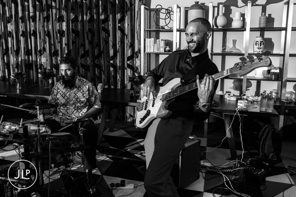 Documentary London wedding photographer black and white shot of a live band performing at a stylish London wedding.