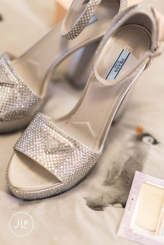 A detailed shot of shimmering silver Prada bridal heels captured by a London wedding photographer.