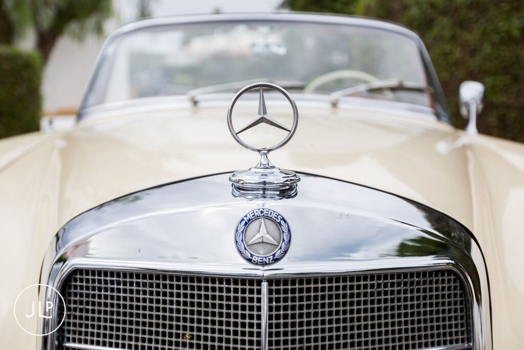 Close-up of the vintage cream Mercedes-Benz wedding car at a luxury Quinta dos Vales wedding in Portugal.