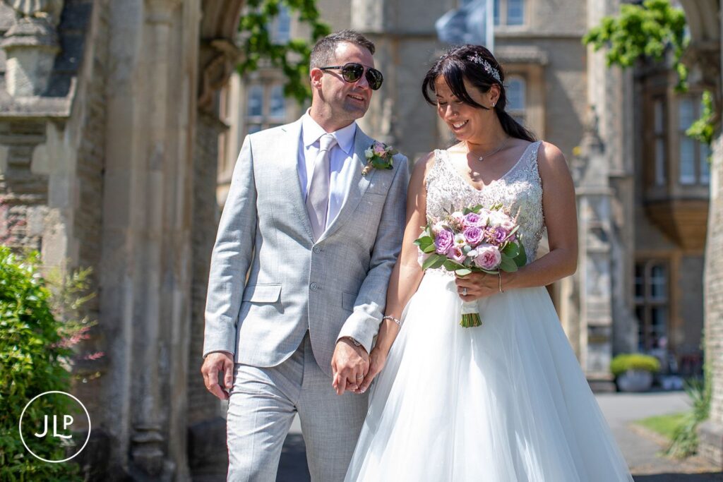 A timeless portrait of the bride and groom at their luxury Gloucestershire wedding venue, focusing on authentic storytelling.