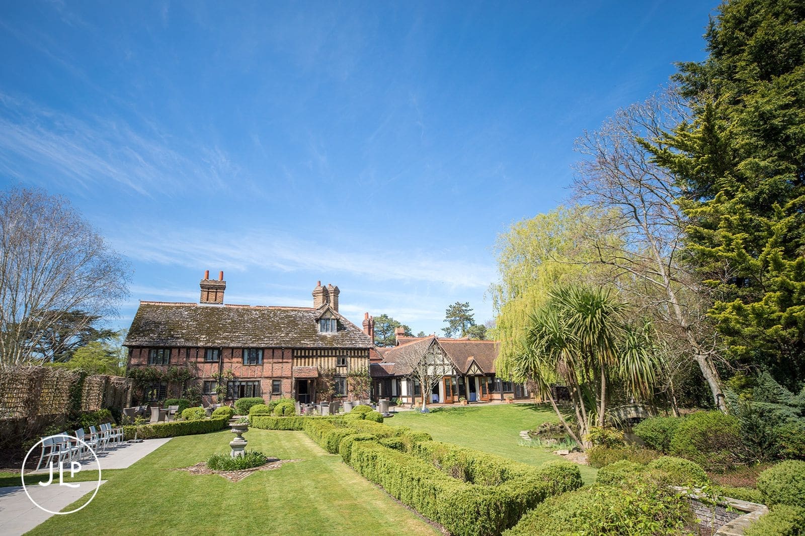 Manicured gardens and lawns at Langshott Manor, perfect for an outdoor wedding ceremony Surrey.