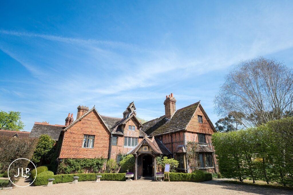 Tudor wedding venue Surrey exterior at Langshott Manor, captured by a Langshott Manor wedding photographer.