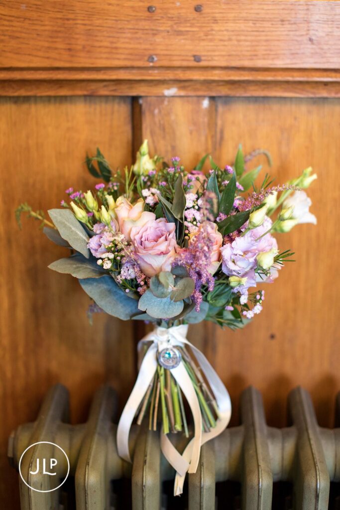Pastel bridal bouquet detail by a Langshott Manor wedding photographer at this boutique manor wedding venue.