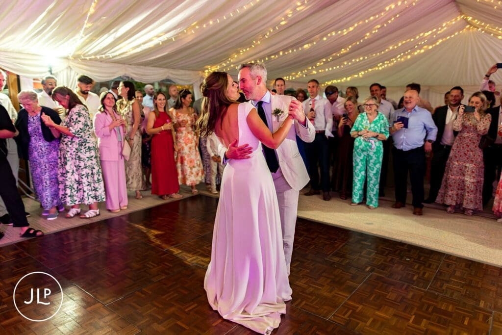Bride and groom first dance at a summer Painshill Park wedding, captured by a Surrey wedding photographer.