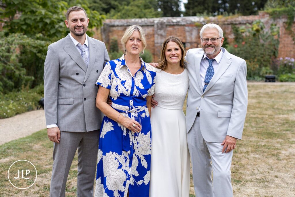 Natural wedding photography of the bride and guests celebrating a beautiful Painshill Park wedding.