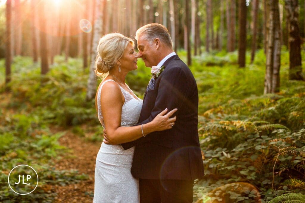 Romantic golden hour portrait by a Cheshire wedding photographer in the Peckforton Castle grounds.