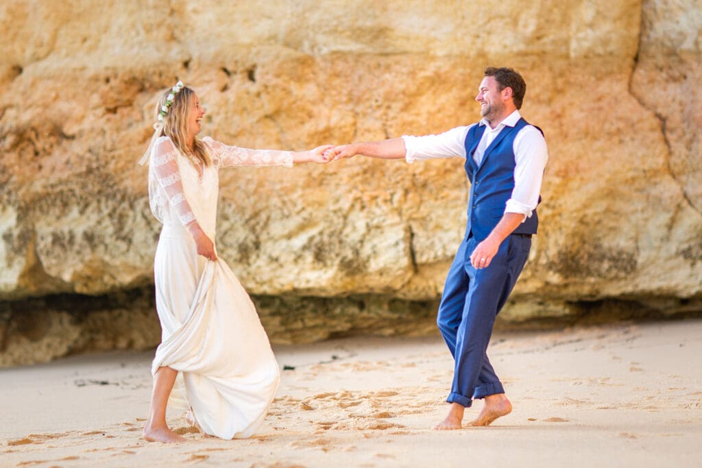 Playful post-wedding beach wedding photography on a quiet stretch of the Algarve coastline.