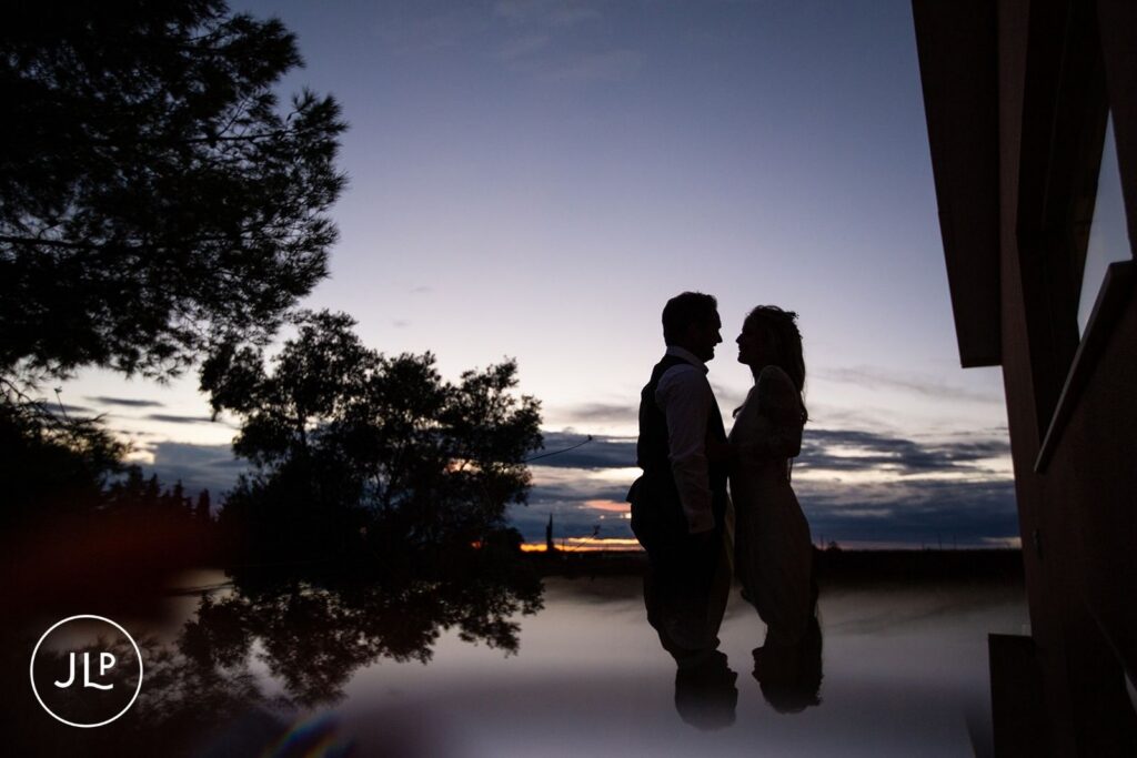 Romantic silhouette of Ali and Matty at dusk, shot by a Portugal destination wedding photographer.