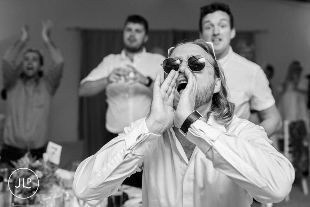 Energetic guest celebration at a Quinta dos Vales wedding reception, shot by an Algarve wedding photographer.