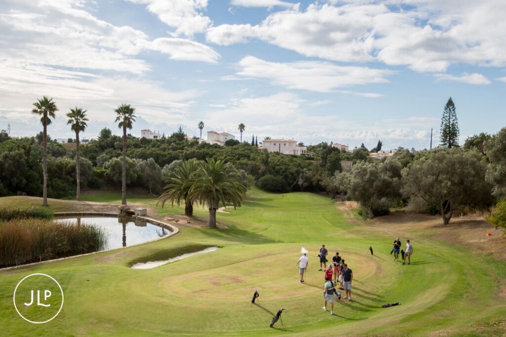 Groomsmen on the green at Vale de Milho Golf course, a unique pre-wedding activity for an Algarve luxury wedding.