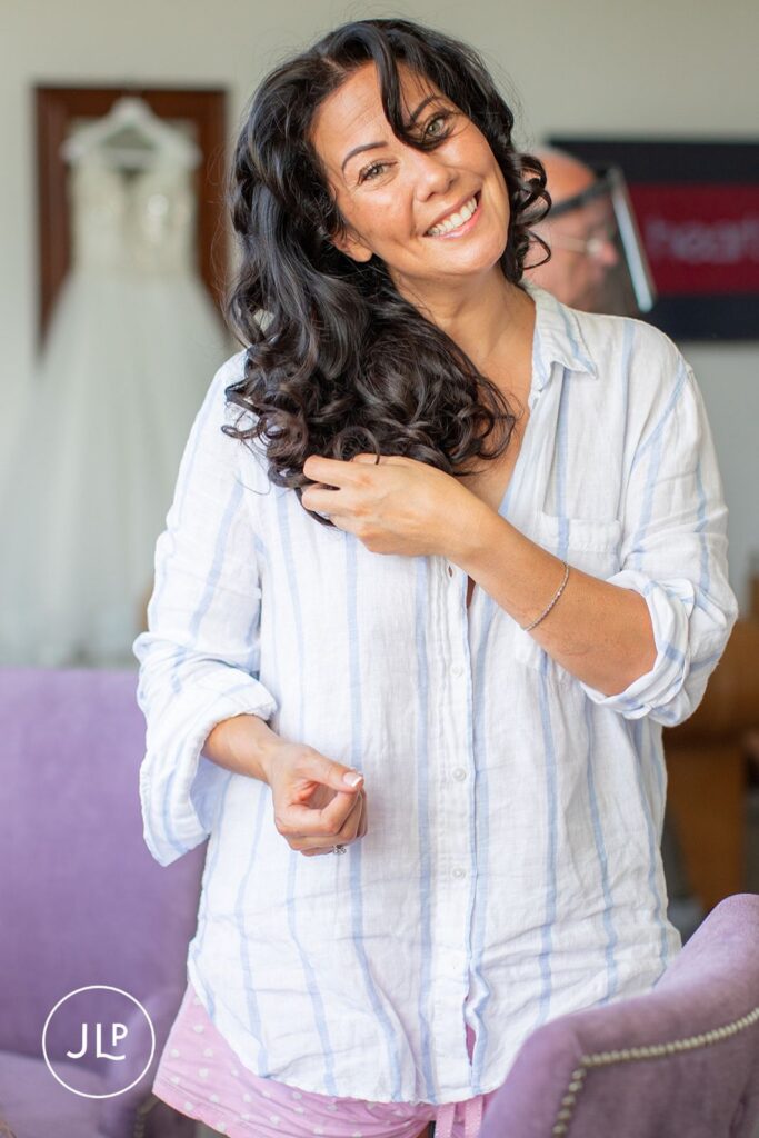 Smiling bride Mel during bridal preparation photography at a luxury Gloucestershire wedding venue.