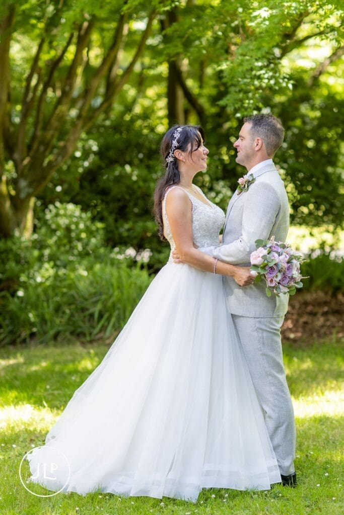 Bride and groom portrait by natural wedding photography Gloucestershire specialist.