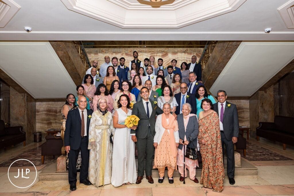 Large group photo of wedding guests with the newlyweds at a Wandsworth Town Hall wedding.