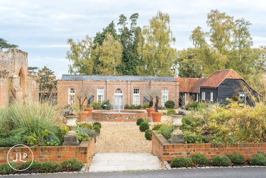 The walled garden fountain at Wasing Park Berkshire, a luxury countryside wedding venue in autumn.