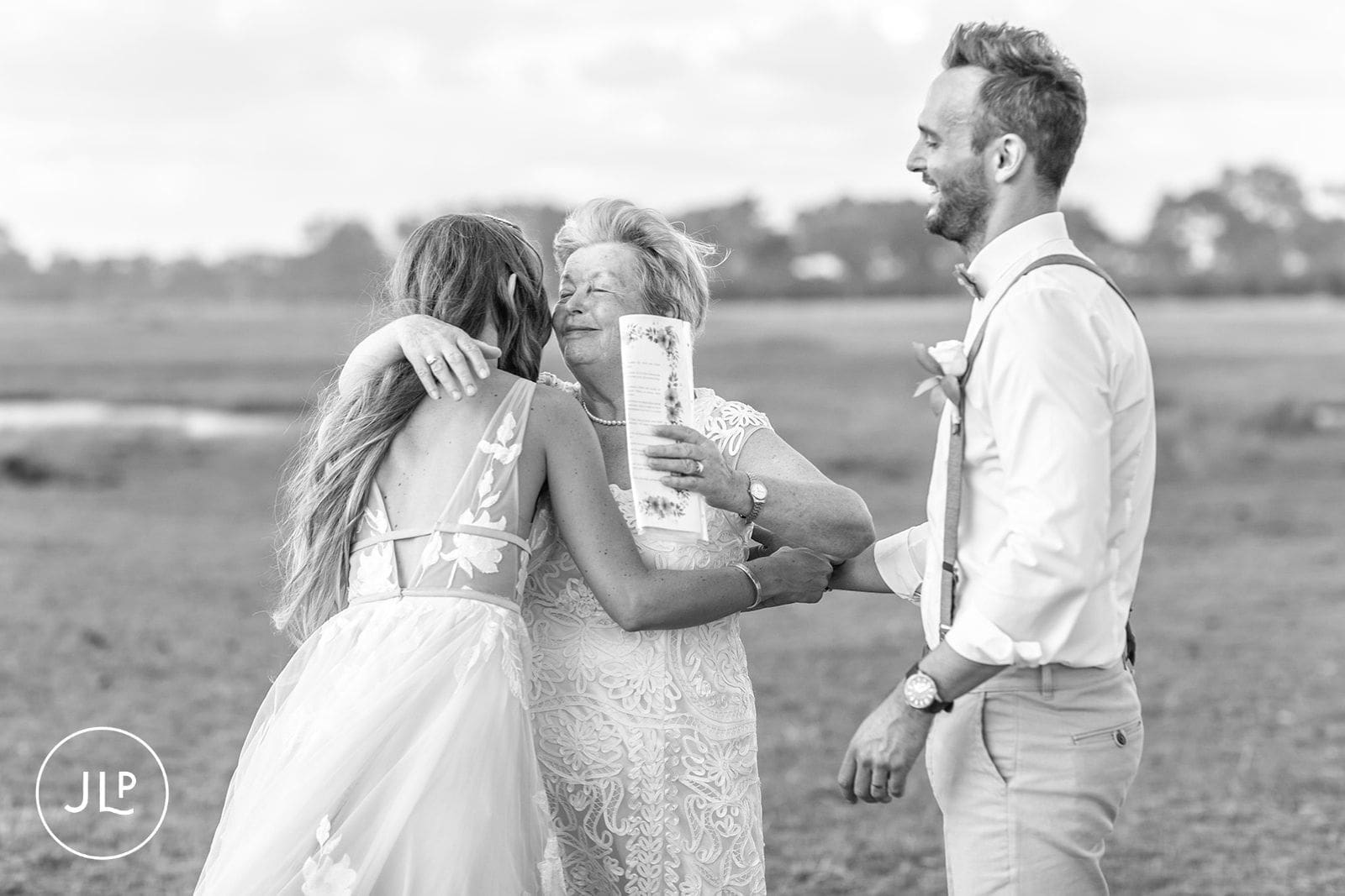 Emotional hug with the bride during an intimate Botswana safari wedding ceremony.