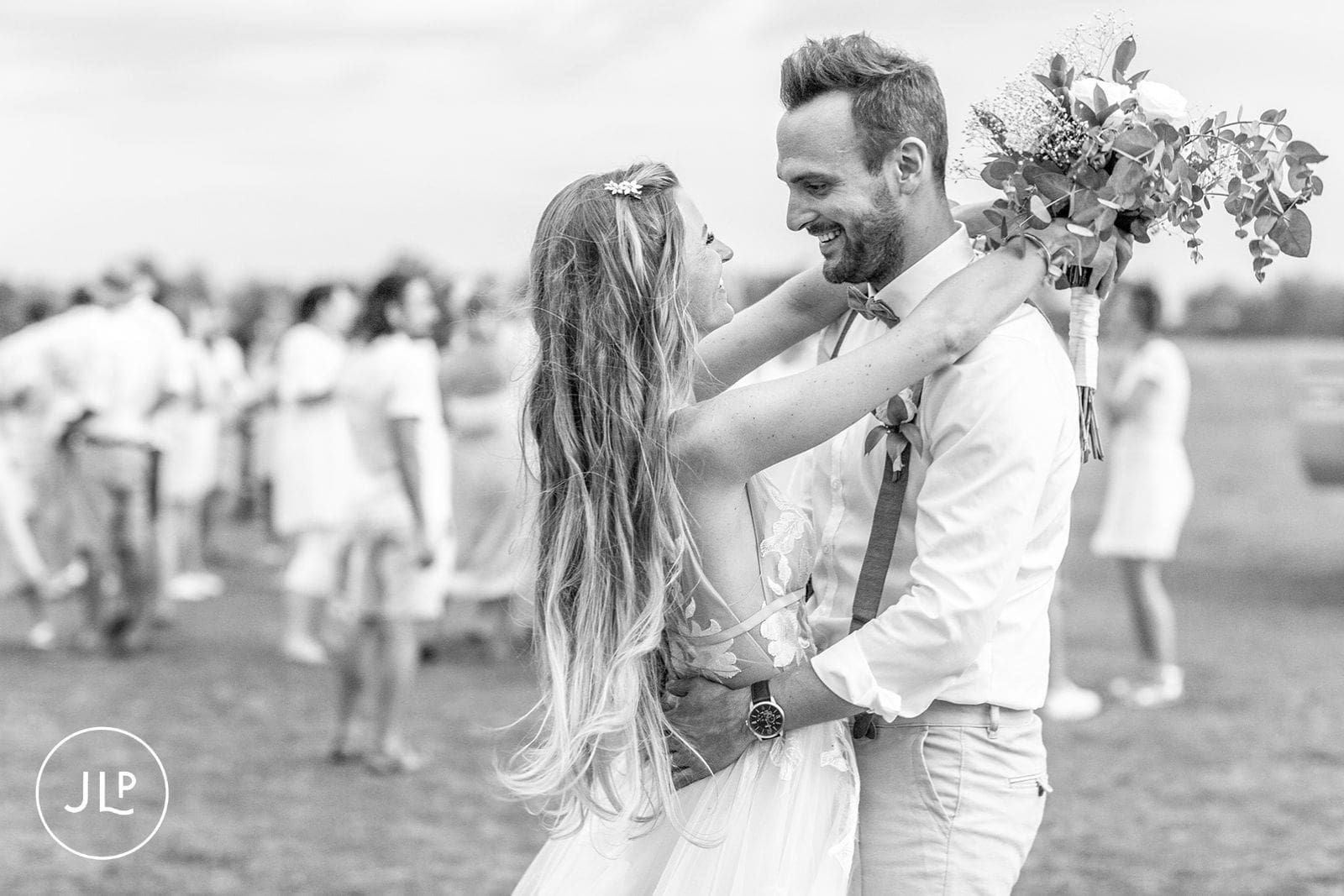 Romantic wedding photography of a newlywed couple embracing in the Okavango Delta.
