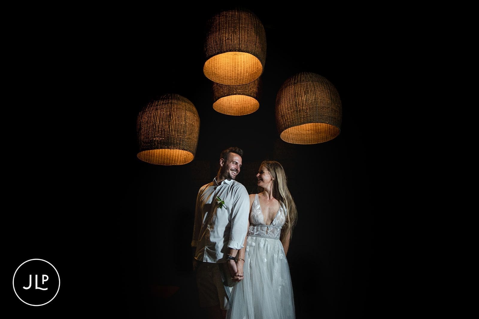 Romantic night portrait of a couple at their Sable Alley destination wedding.