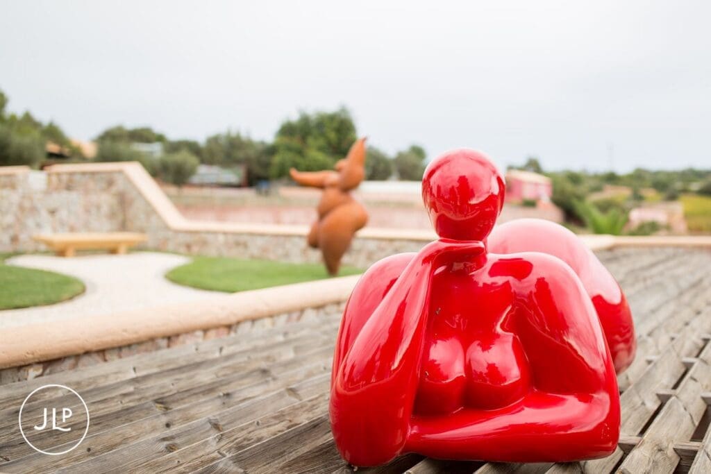 Red contemporary art sculpture on display at a luxury Algarve destination wedding venue.