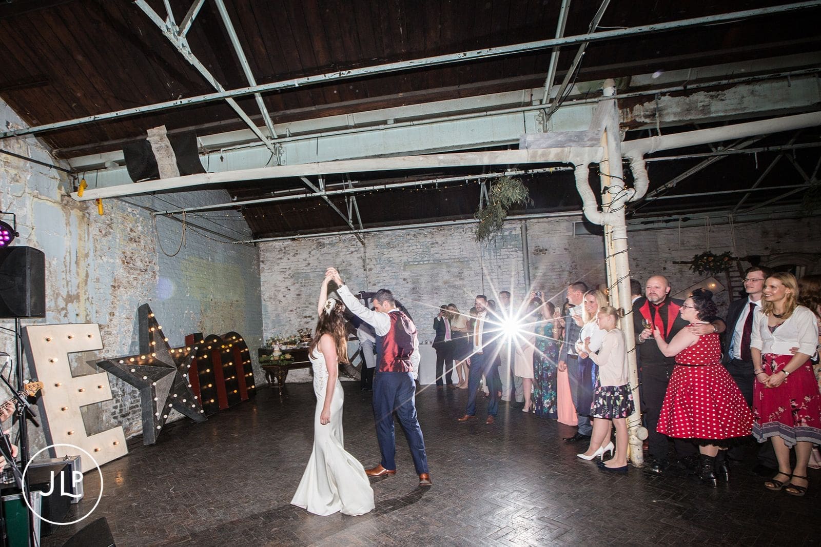 First dance captured by an East London warehouse wedding photographer during the party.